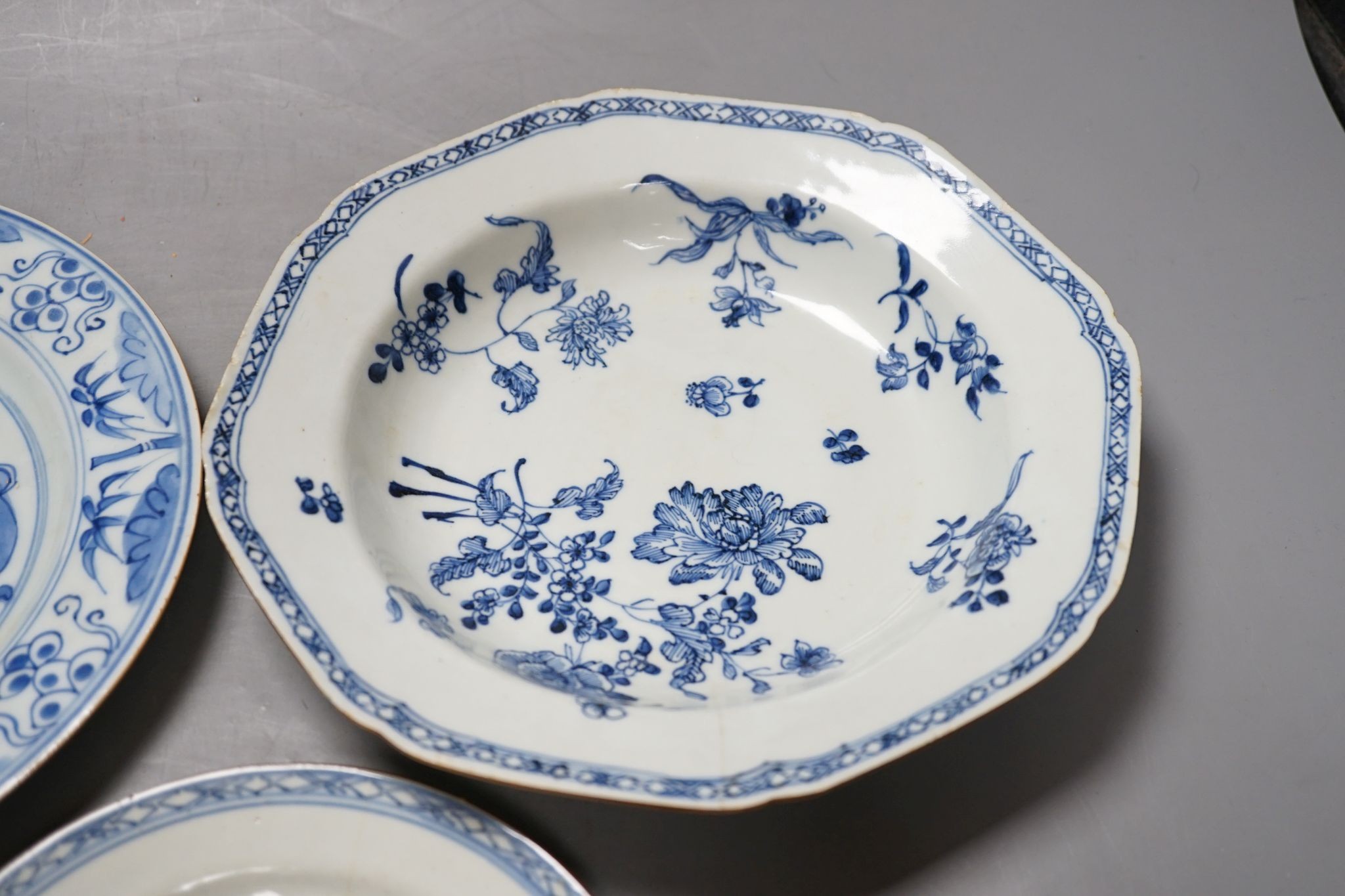 A Set of six 18th century Chinese export blue and white ‘bird in a cage’ small plates, 6.3 cm diameter and two pairs of 18th century Chinese export blue and white plates dishes, largest 23cm diam (10)